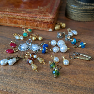 Collection of historical jewelry pieces on a wooden surface