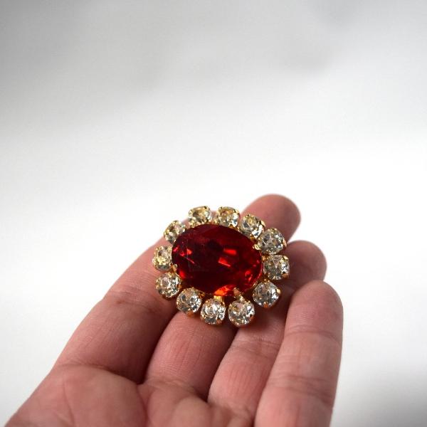 Red brooch hotsell