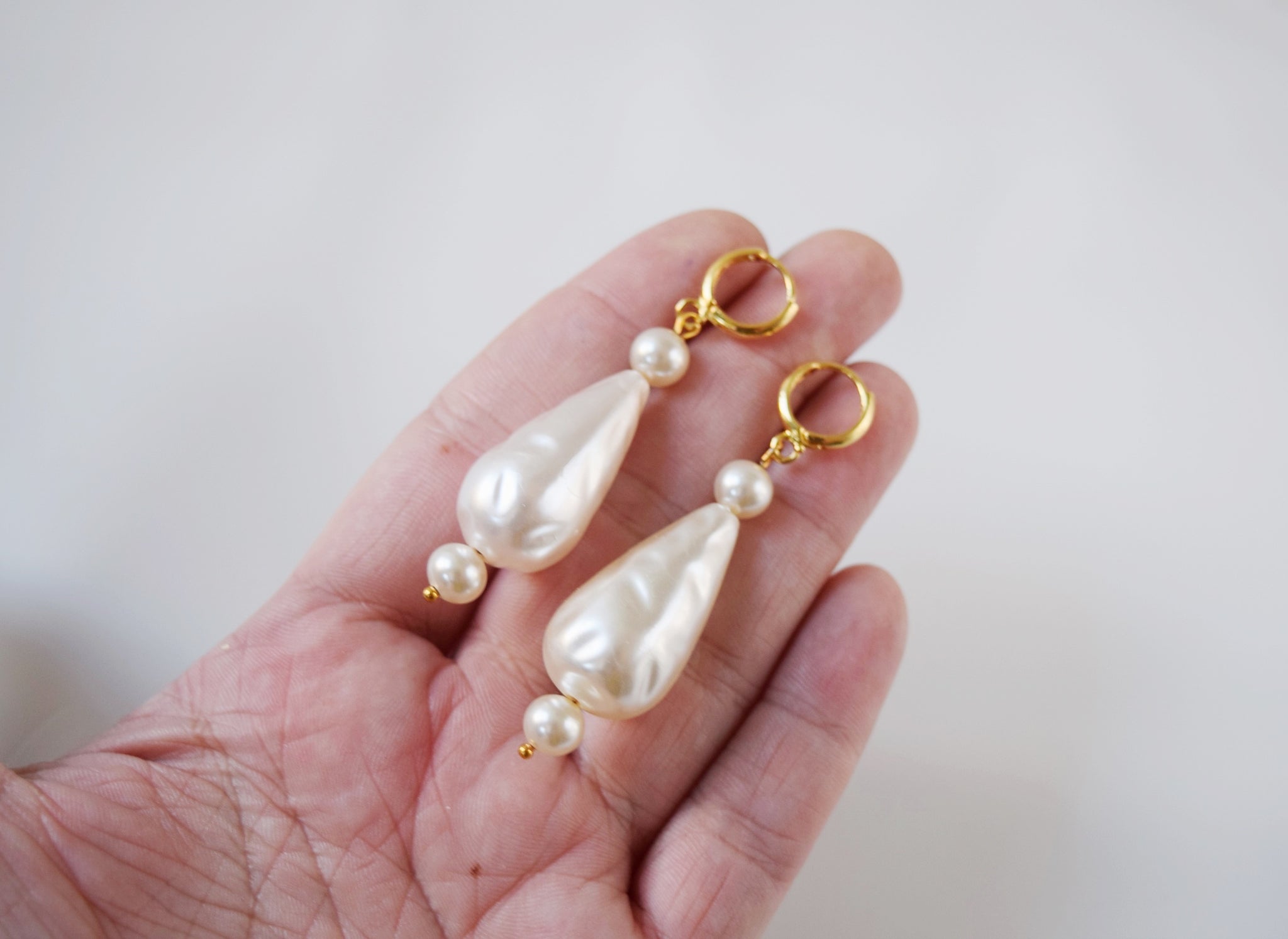 Faux pearl dangle earrings on sale